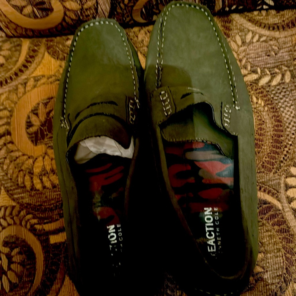 Men’s manmade upper penny loafer by reaction Kenneth Cole.  New without tags.